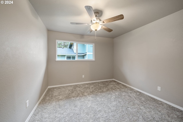 carpeted empty room with ceiling fan