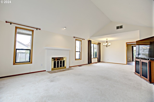 unfurnished living room with lofted ceiling, a wealth of natural light, and light colored carpet