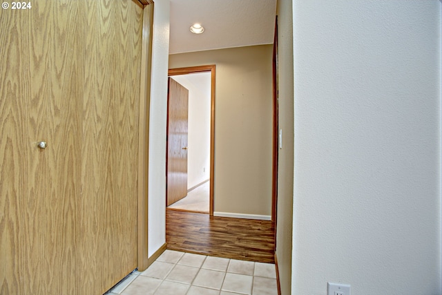 hallway with light hardwood / wood-style flooring