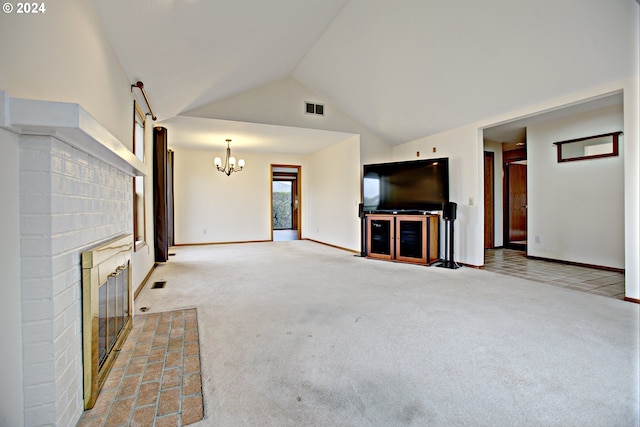 unfurnished living room featuring light carpet, a notable chandelier, high vaulted ceiling, and a brick fireplace