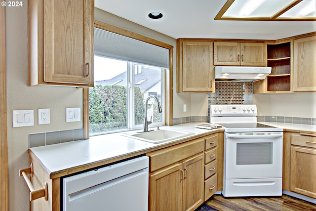 kitchen featuring light brown cabinets, sink, dark hardwood / wood-style flooring, white appliances, and tasteful backsplash