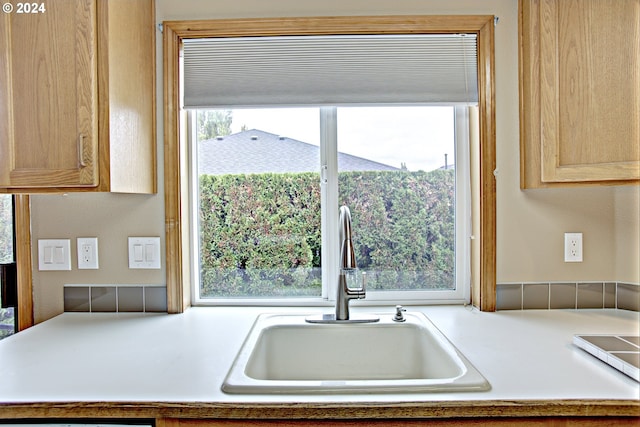 kitchen featuring sink and light brown cabinets