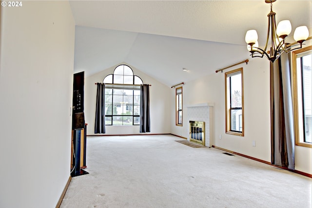 unfurnished living room with a notable chandelier, lofted ceiling, and light colored carpet