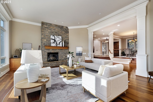 18262 Meadowlark Ln, Lake Oswego, OR 97034 - living area featuring decorative columns, crown molding, healthy amount of natural light, wood finished floors, and a fireplace