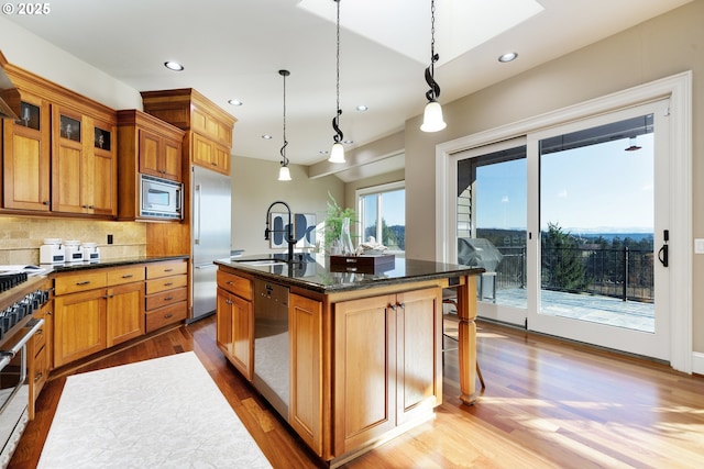 18262 Meadowlark Ln, Lake Oswego, OR 97034 - kitchen featuring built in appliances, a sink, wood finished floors, an island with sink, and recessed lighting