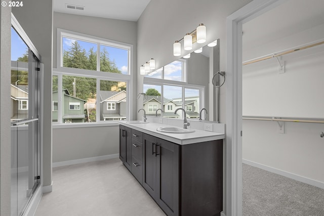 bathroom with lofted ceiling and vanity