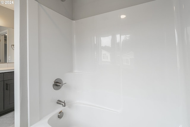 bathroom with shower / washtub combination and vanity