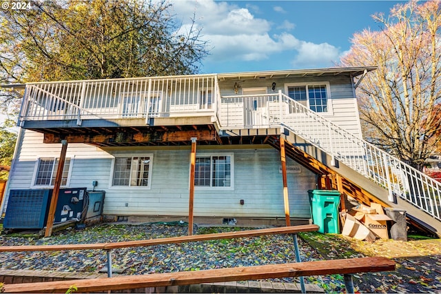 rear view of property with a deck