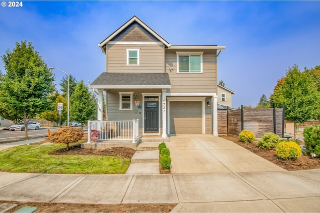 view of front of home with a garage and covered porch