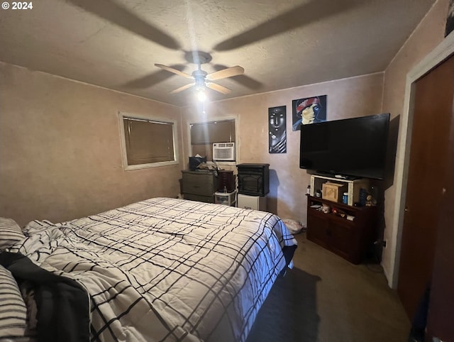 carpeted bedroom featuring a textured ceiling, cooling unit, and ceiling fan