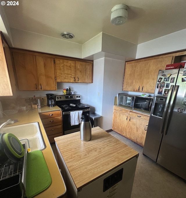 kitchen featuring stainless steel appliances and sink