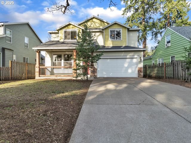 view of front of house with a garage and covered porch