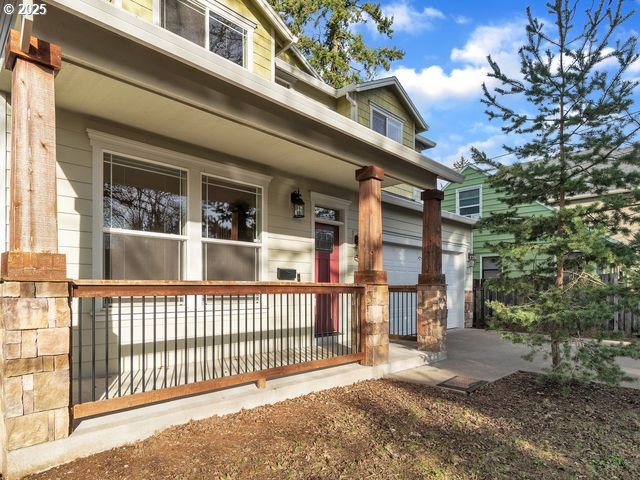 doorway to property featuring covered porch