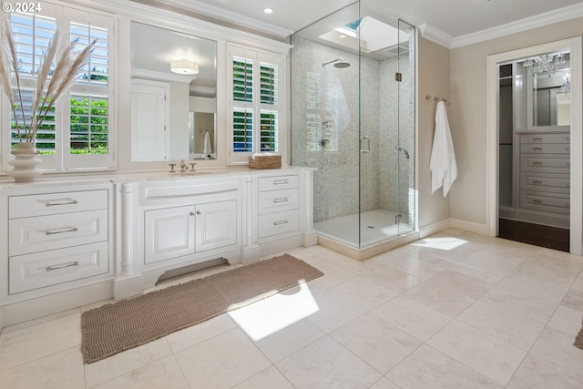 bathroom featuring ornamental molding, a shower with shower door, vanity, and tile patterned flooring