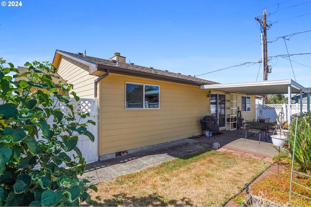 back of property featuring a patio area