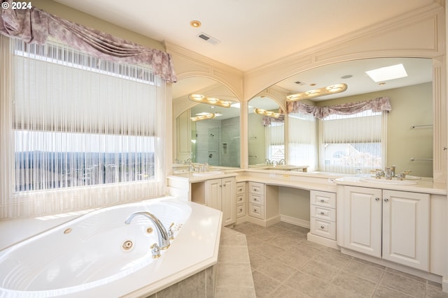 bathroom featuring a jetted tub, two vanities, a sink, and visible vents