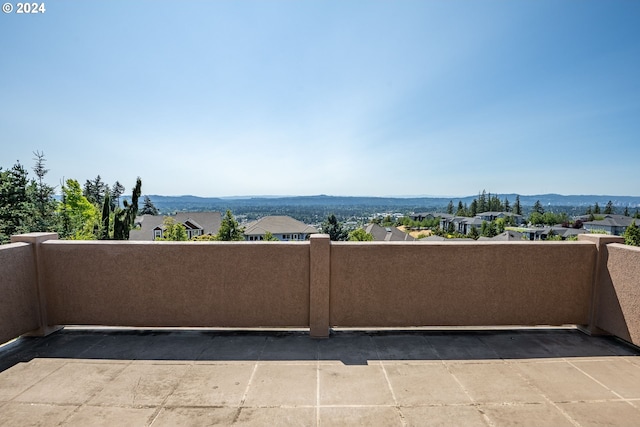 balcony with a residential view and a mountain view