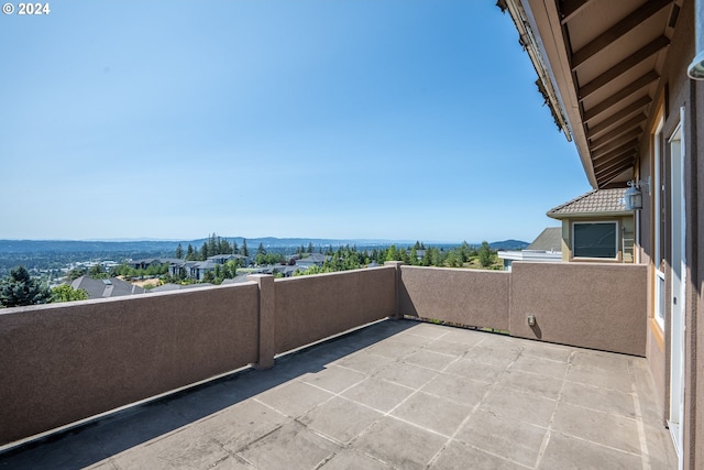 balcony featuring a patio and a mountain view