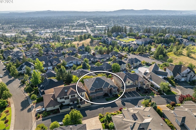 birds eye view of property with a residential view