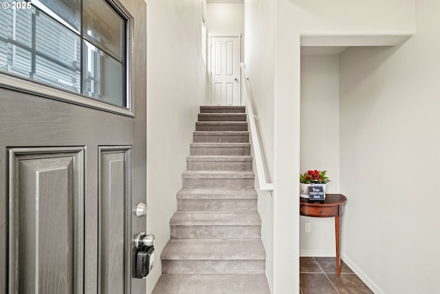 stairs with tile patterned flooring