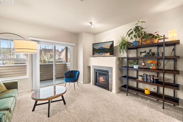 carpeted living room featuring a fireplace