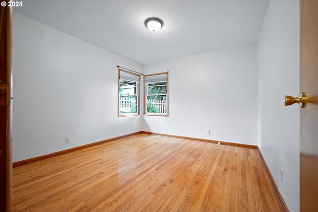 spare room with light hardwood / wood-style floors