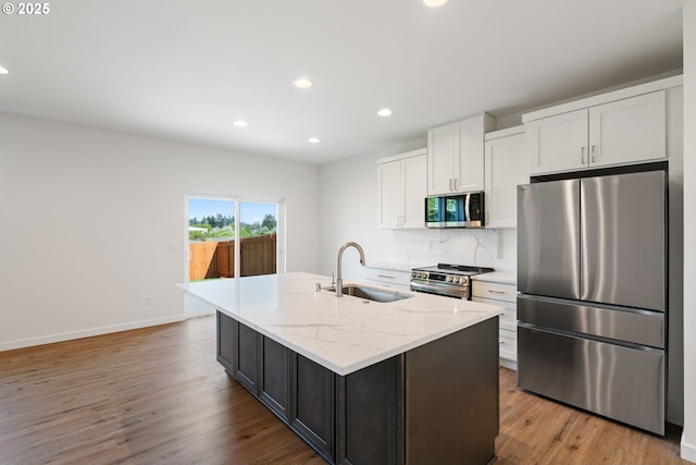 11116 NE 91st Ave, Vancouver, WA 98662 - kitchen featuring recessed lighting, a sink, white cabinetry, and stainless steel appliances