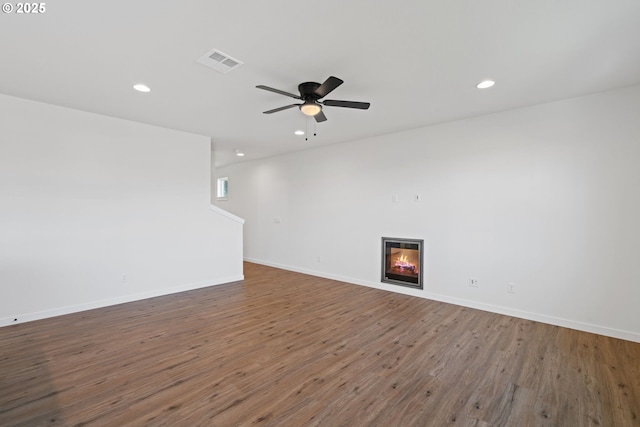 11116 NE 91st Ave, Vancouver, WA 98662 - unfurnished living room featuring visible vents, a glass covered fireplace, wood finished floors, recessed lighting, and a ceiling fan