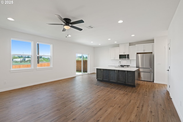 11116 NE 91st Ave, Vancouver, WA 98662 - kitchen with appliances with stainless steel finishes, open floor plan, wood finished floors, and visible vents