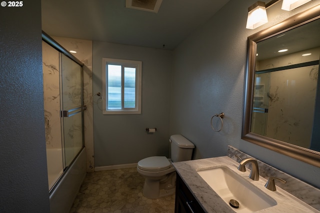 bathroom featuring toilet, vanity, visible vents, baseboards, and combined bath / shower with glass door