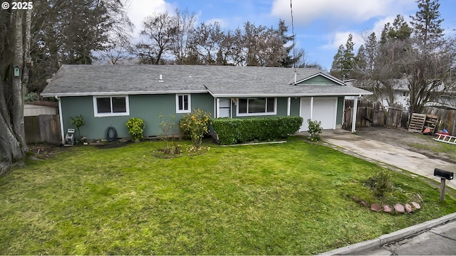 ranch-style house featuring concrete driveway, a front lawn, an attached garage, and fence