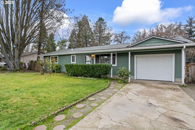 single story home featuring a garage and a front lawn