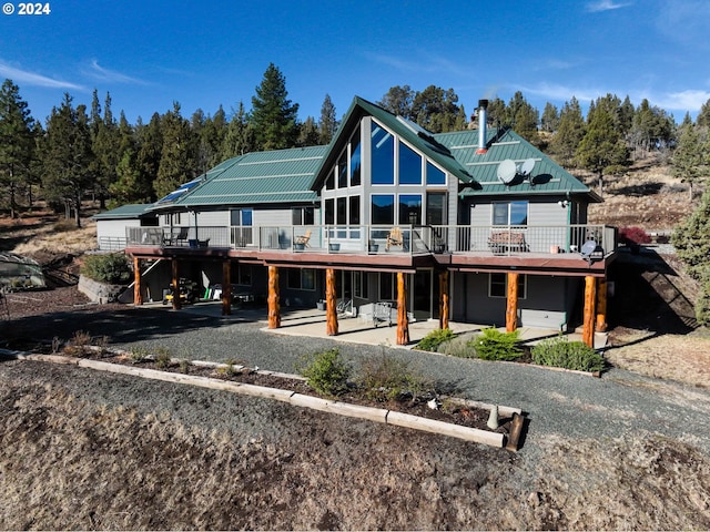 31367 Clarks Creek Rd, Mount Vernon, OR 97865 - rear view of house with a deck, a patio area, and metal roof