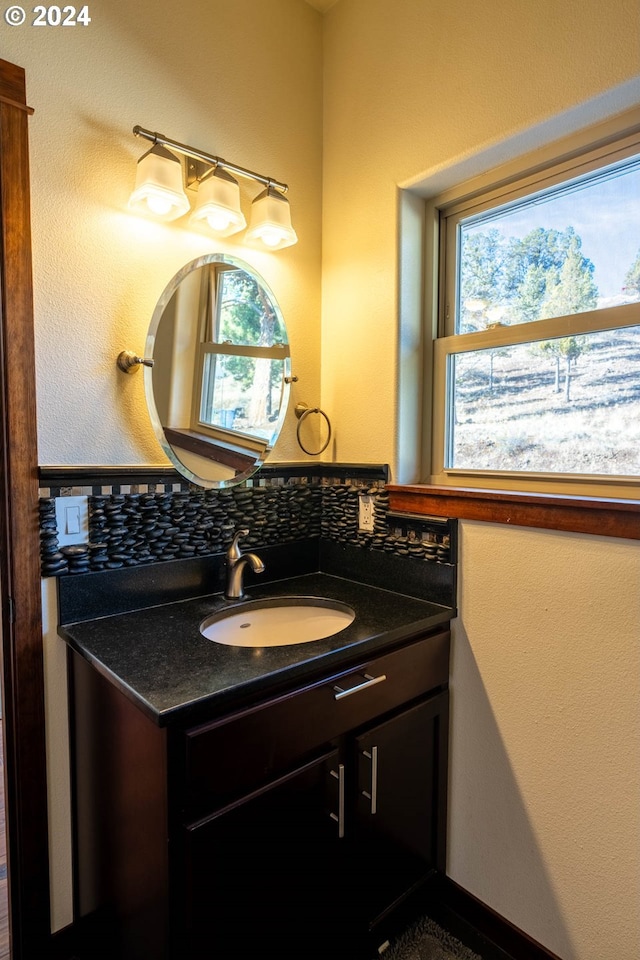 31367 Clarks Creek Rd, Mount Vernon, OR 97865 - bathroom featuring vanity and backsplash
