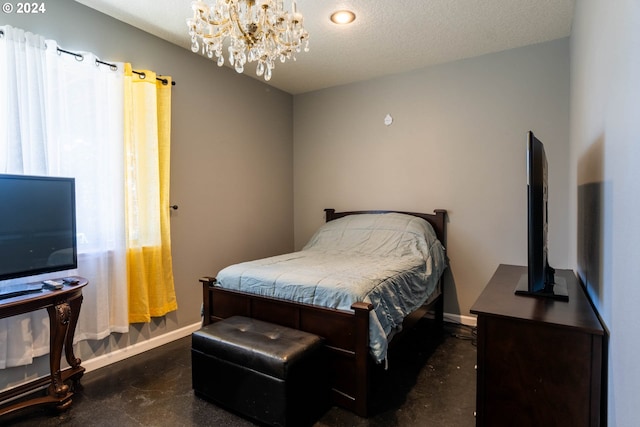 bedroom with a textured ceiling and an inviting chandelier