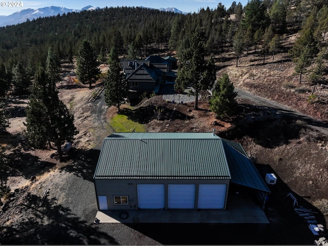 birds eye view of property featuring a mountain view