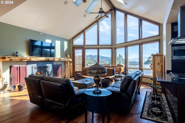 31367 Clarks Creek Rd, Mount Vernon, OR 97865 - living area with high vaulted ceiling, wood-type flooring, plenty of natural light, ceiling fan, and beam ceiling