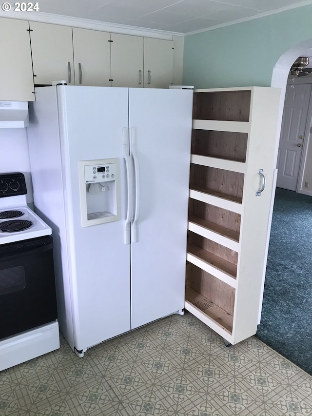 kitchen with electric stove, range hood, white refrigerator with ice dispenser, white cabinets, and light colored carpet