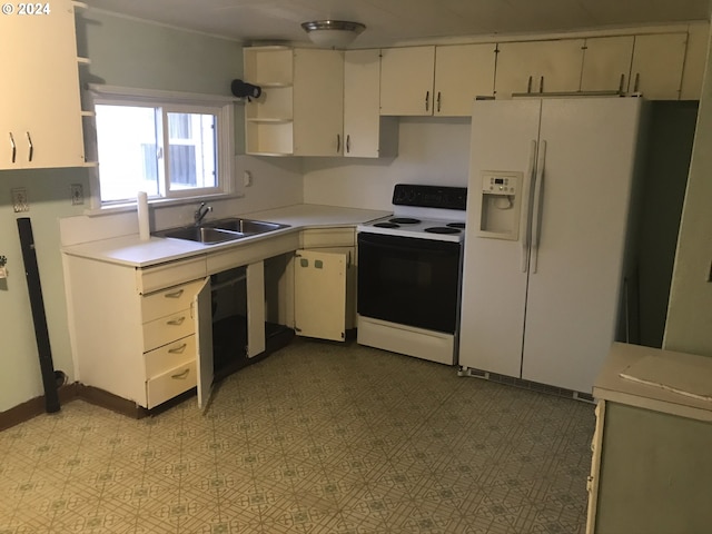 kitchen featuring electric stove, sink, and white refrigerator with ice dispenser