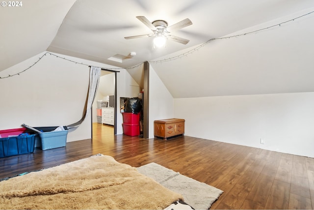 bonus room with lofted ceiling, ceiling fan, and dark wood-type flooring