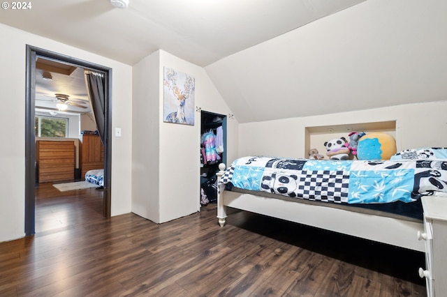 bedroom featuring dark hardwood / wood-style flooring and vaulted ceiling