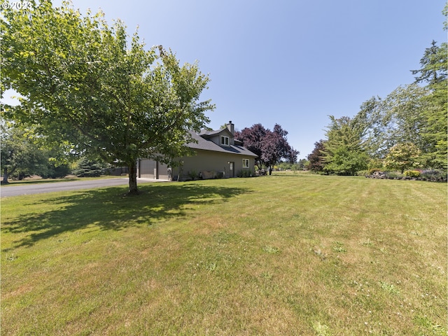 view of yard featuring a garage