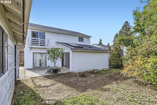 back of house featuring a patio