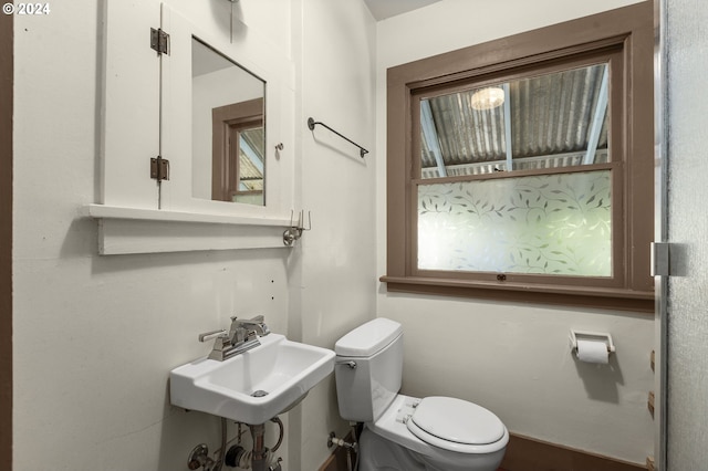 bathroom with sink and toilet