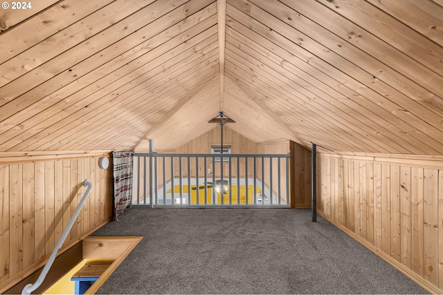 bonus room featuring carpet floors, wood walls, and wood ceiling