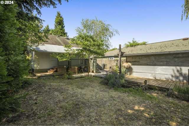 view of yard featuring a wooden deck