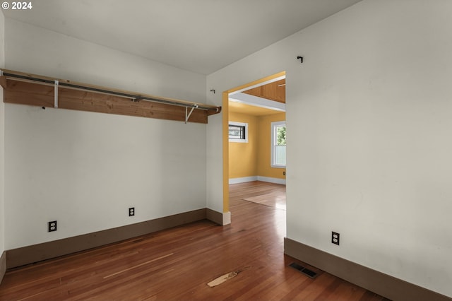 empty room featuring dark hardwood / wood-style flooring