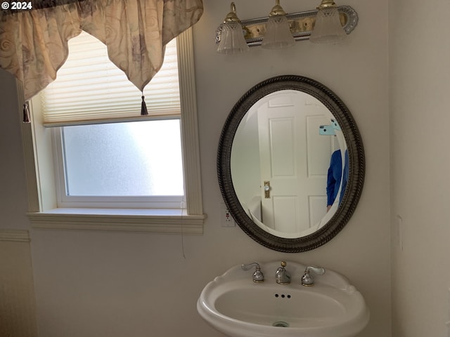 bathroom featuring a healthy amount of sunlight and sink