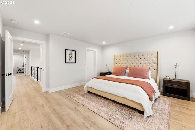 bedroom with light hardwood / wood-style floors