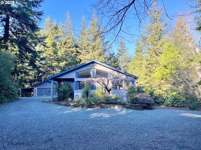 view of front of property featuring a carport